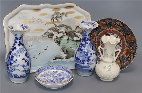 A Japanese Imari plate, two vases, a tray, a Belleek vase and two saucers tallest 21cm